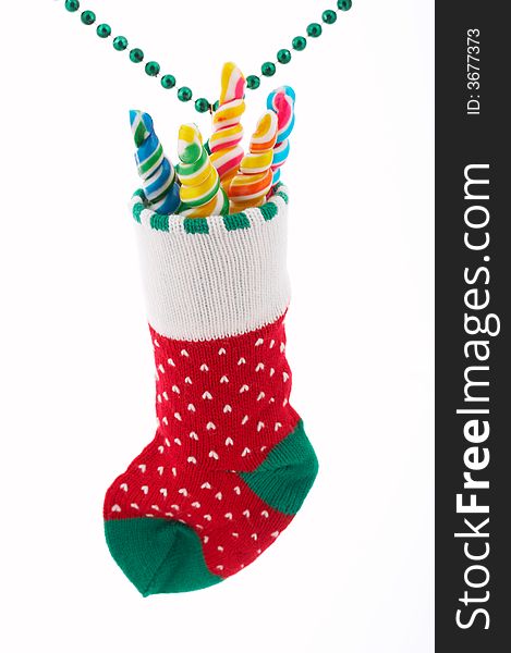 A christmas stocking with lollipop candies inside. A christmas stocking with lollipop candies inside
