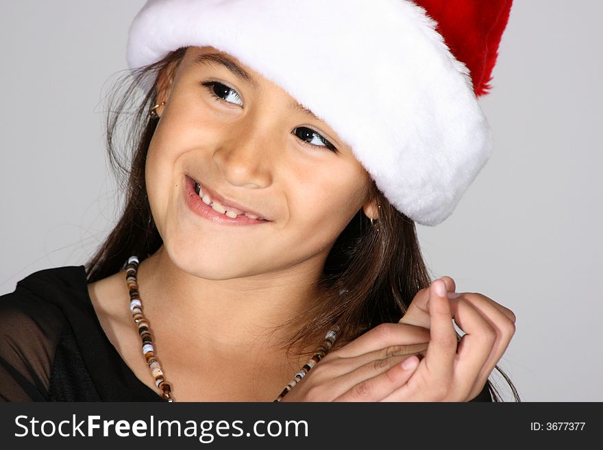 Portrait of cute young girl with Santa hat. Portrait of cute young girl with Santa hat