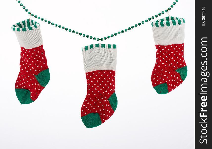 Christmas stockings hanging over a white background