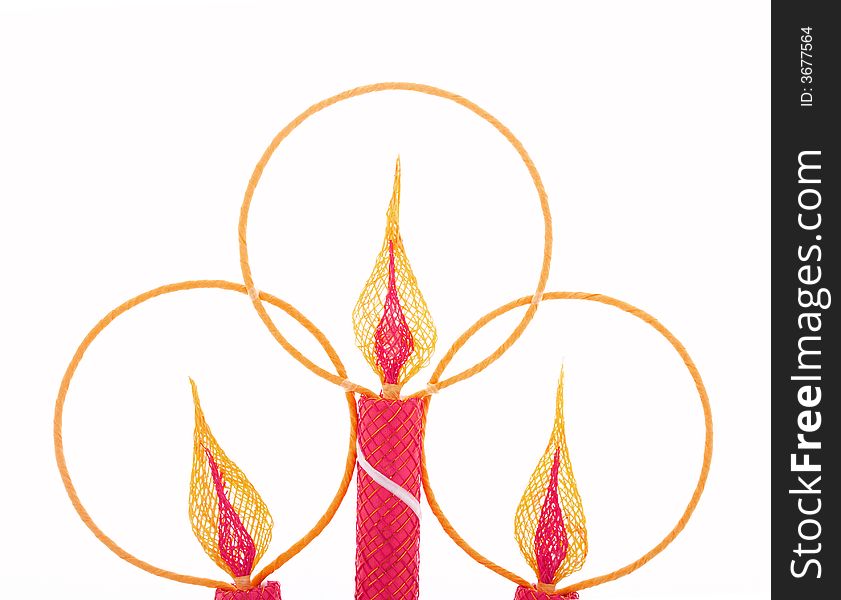 A christmas candle decoration over a white background