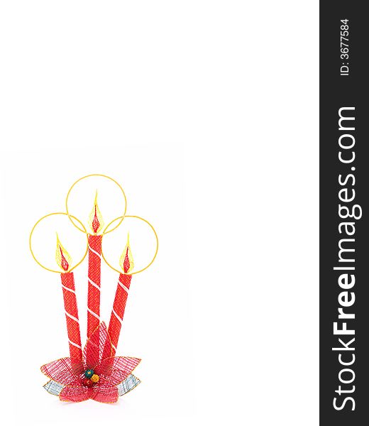 A christmas candle decoration over a white background