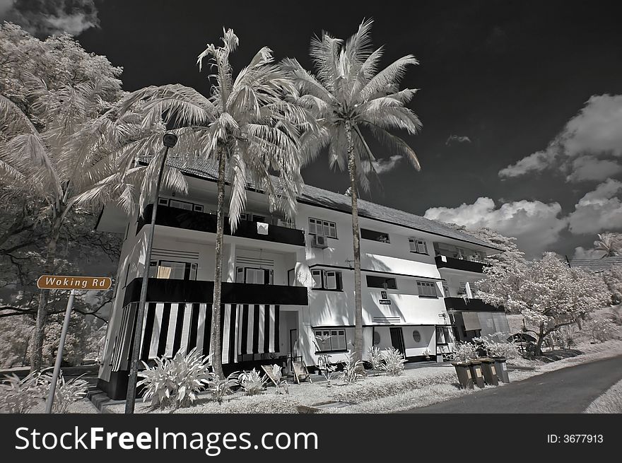 Infrared photo – tree, old house and cloud in the parks