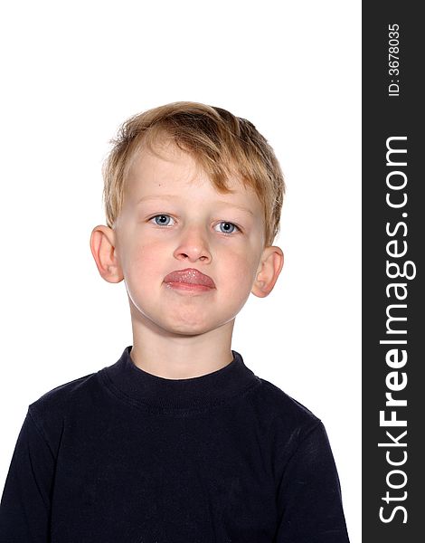 Cute blond toddler boy sticking out his tongue. Cute blond toddler boy sticking out his tongue