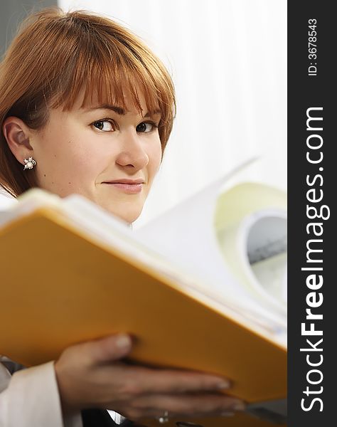 Women holding a file. yellow