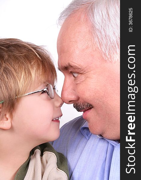 Grandfather grandson forehead over white background