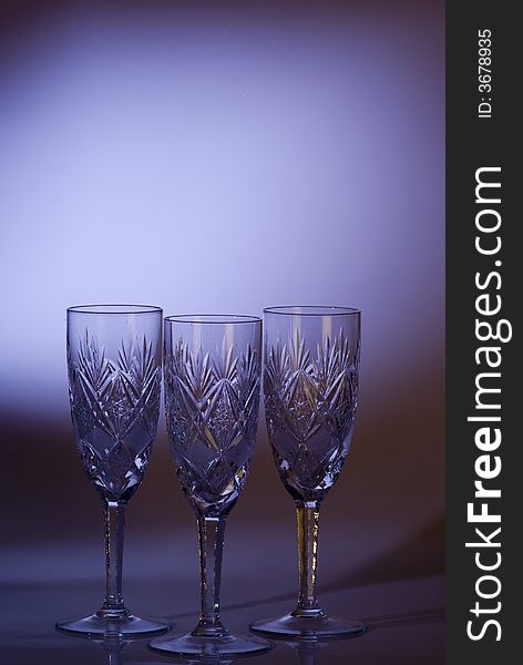 Luxurious glasses on a violt background
