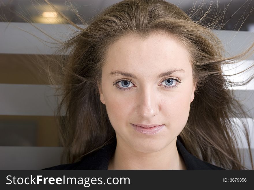 Portrait of a friendly professional woman looking nicely at the camera. Portrait of a friendly professional woman looking nicely at the camera.