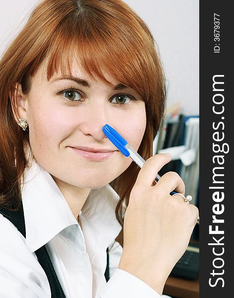 Smiling woman with pen