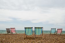 Deck Chairs On Brighton Beach, England Stock Images