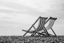 Black And White Deck Chairs On Brighton Beach, England Stock Image Black And White Deck Chairs On Brighton Beach, England Stock Image