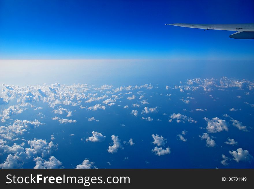 View from the airplane window, ocean blue