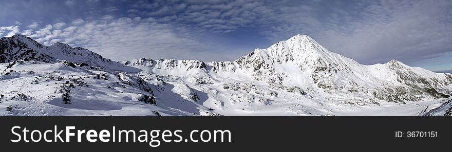 Mountain ridge in winter. panoramic picture composed of stitched images