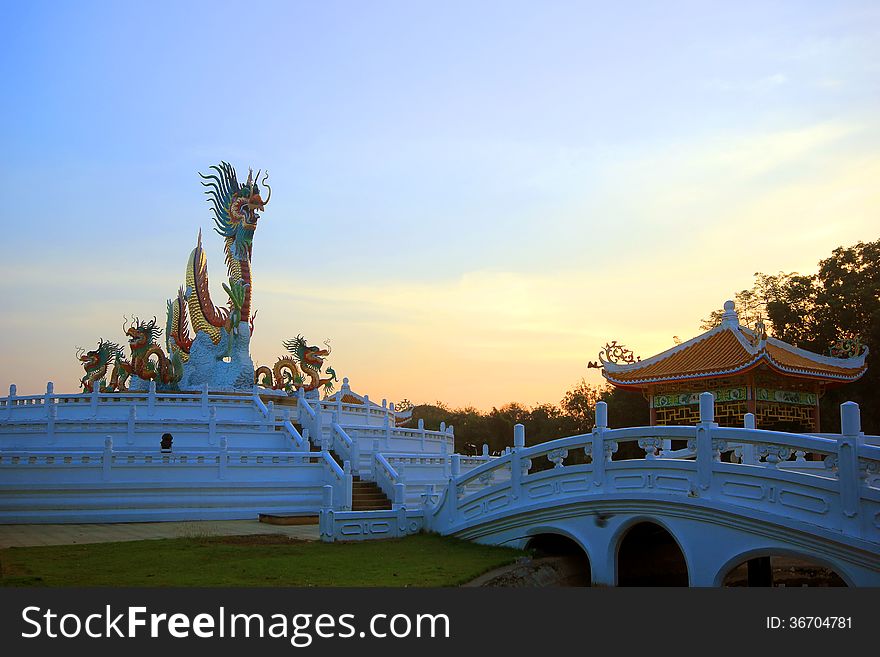 Golden Chinese dragon statue on beautiful sky background