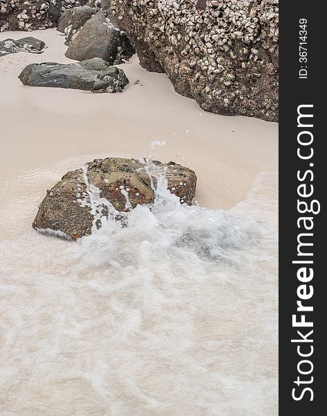 Beach sand getting wet by the sea water. Beach sand getting wet by the sea water.