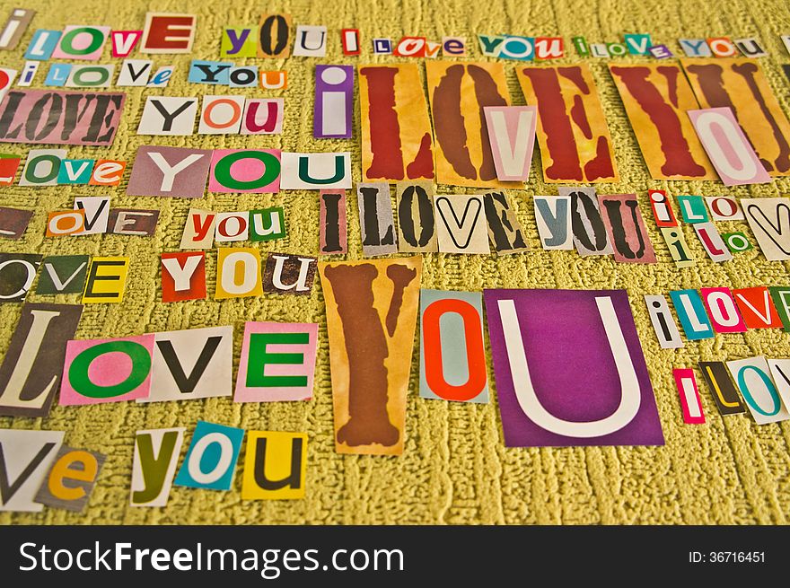 I LOVE YOU message from letters cut out of newspapers and magazines