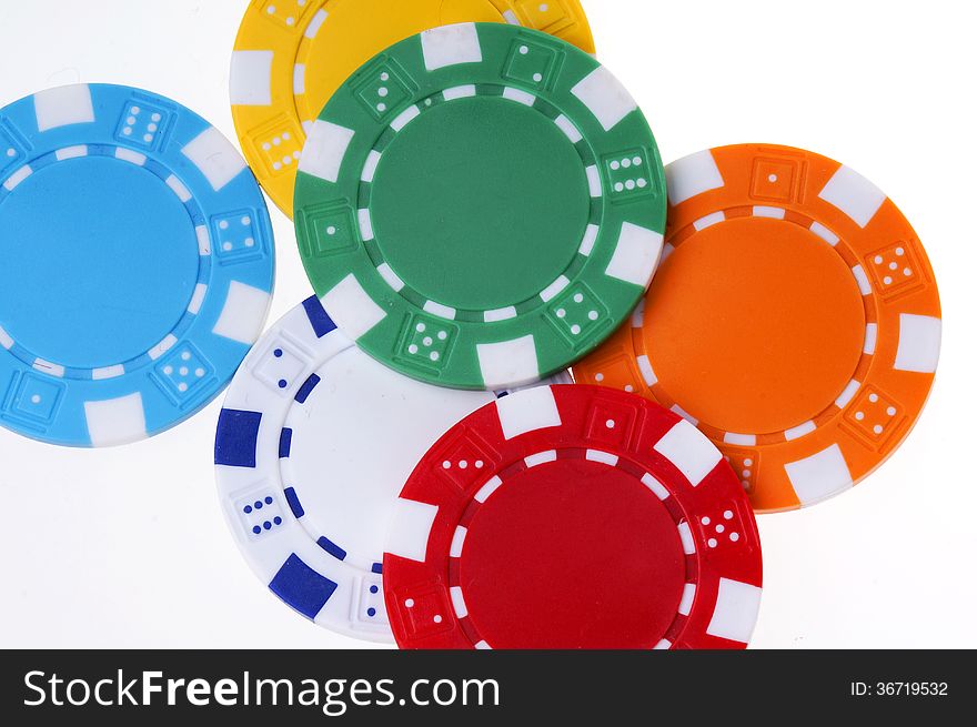 Colorful plastic chips on white background. Colorful plastic chips on white background.