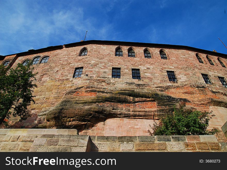 In Nuremberg. The wall is natural rock under the windows, buidling directly out of the sandstone. In Nuremberg. The wall is natural rock under the windows, buidling directly out of the sandstone