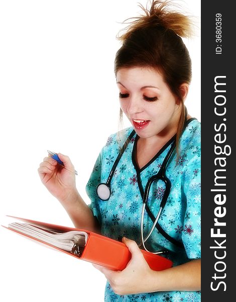 Beautiful young nurse with pen and folder.