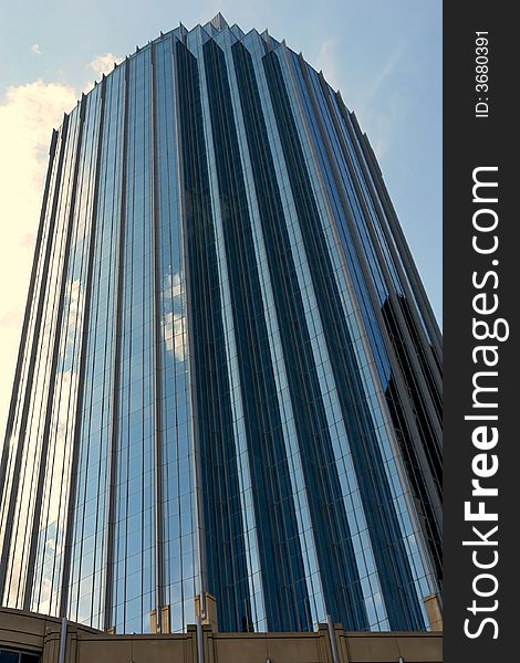 Dramatic shot of glass and steel office building in copley square, boston massachusetts