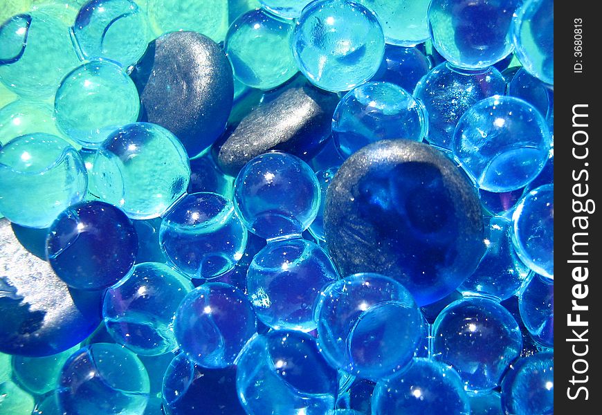 Blue Gems and Bubbles floating over water. Blue Gems and Bubbles floating over water