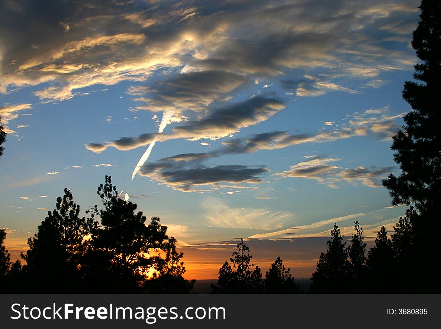 Lots of little clouds strewn over a sunset. Lots of little clouds strewn over a sunset.