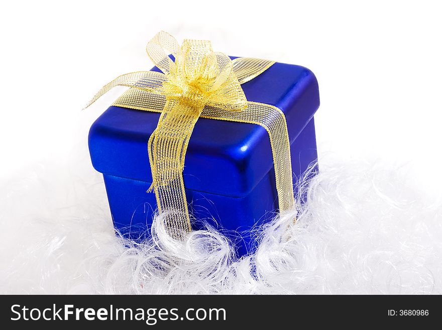 Blue box with yellow bow, with gift, low DOF. Blue box with yellow bow, with gift, low DOF