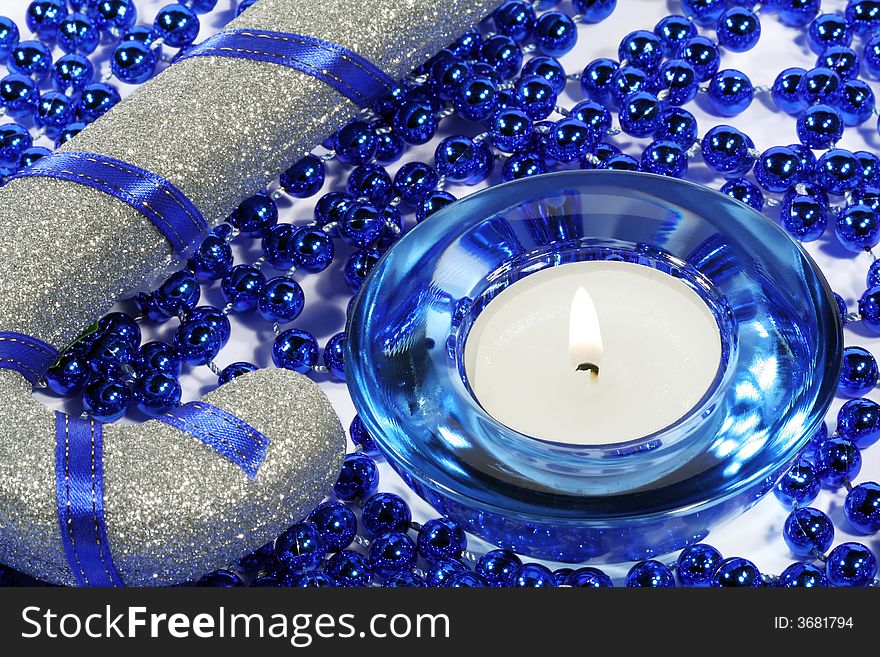 New-years decoration (candle, tinsel )