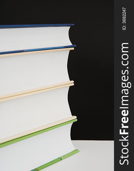 Stack of books - isolated over black background