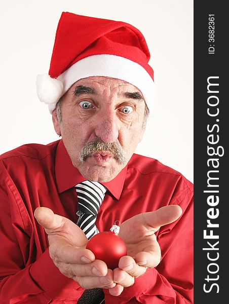 Man with santas's hat with christmas ornament on white background. Man with santas's hat with christmas ornament on white background