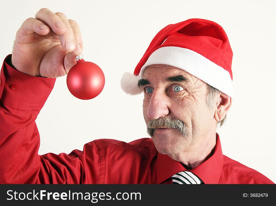 Man with santas's hat with christmas ornament on white background. Man with santas's hat with christmas ornament on white background