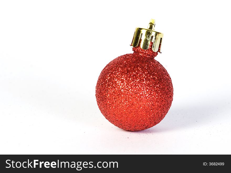 Small sparkle red christmas globe on white background. Small sparkle red christmas globe on white background