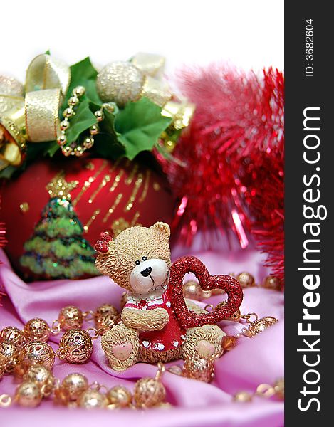 Bear figurine with red heart and Christmas decoration. Bear figurine with red heart and Christmas decoration