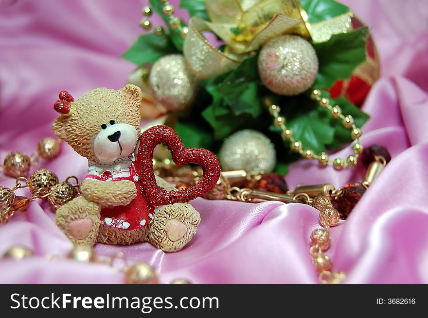 Bear figurine with red heart and Christmas decoration. Bear figurine with red heart and Christmas decoration