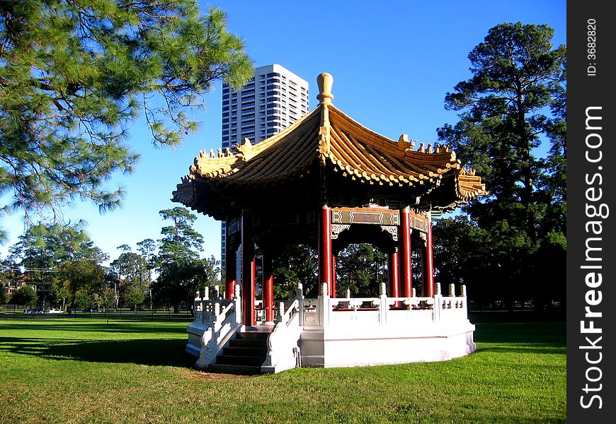 Japanese garden with Pagoda and high-rise building behind