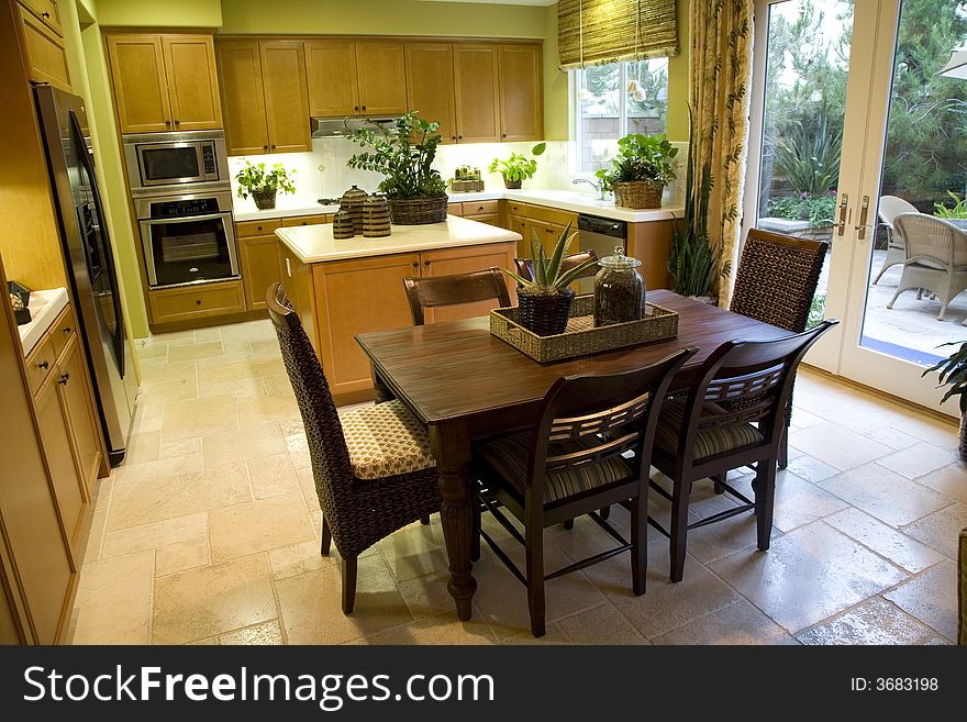 Luxury kitchen with table and island. Luxury kitchen with table and island.