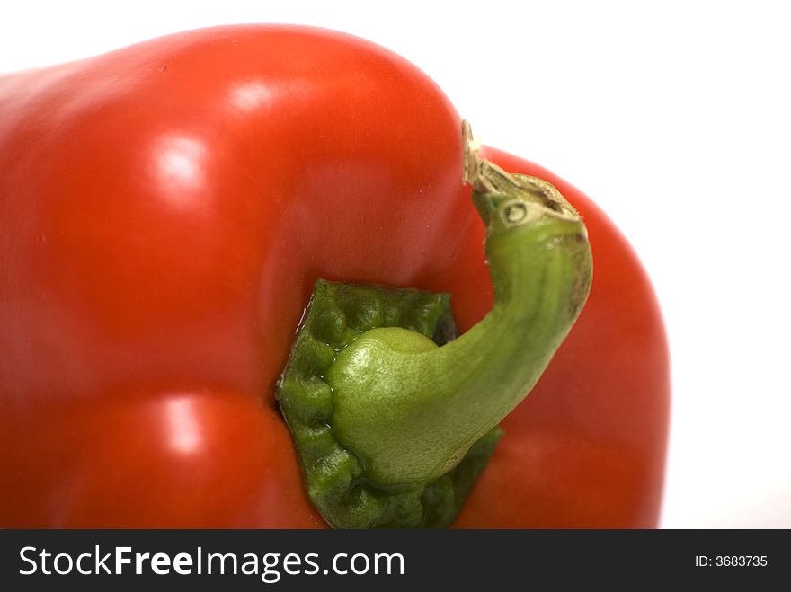 Red pepper on the white background. Close-up view. Red pepper on the white background. Close-up view.