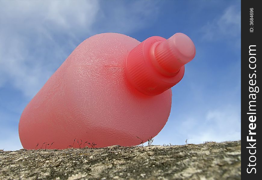 Details of a pink hairspray atomiser bottle. Details of a pink hairspray atomiser bottle
