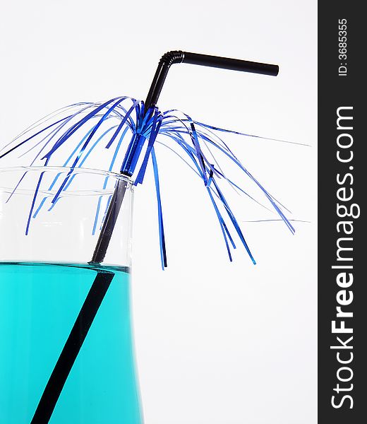 Fragment of glass with cocktail and straw. Fragment of glass with cocktail and straw