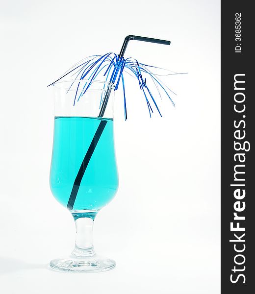 One glass with blue cocktail and straw on the white background