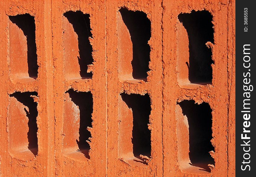 Details of the holes of a red brick. Details of the holes of a red brick