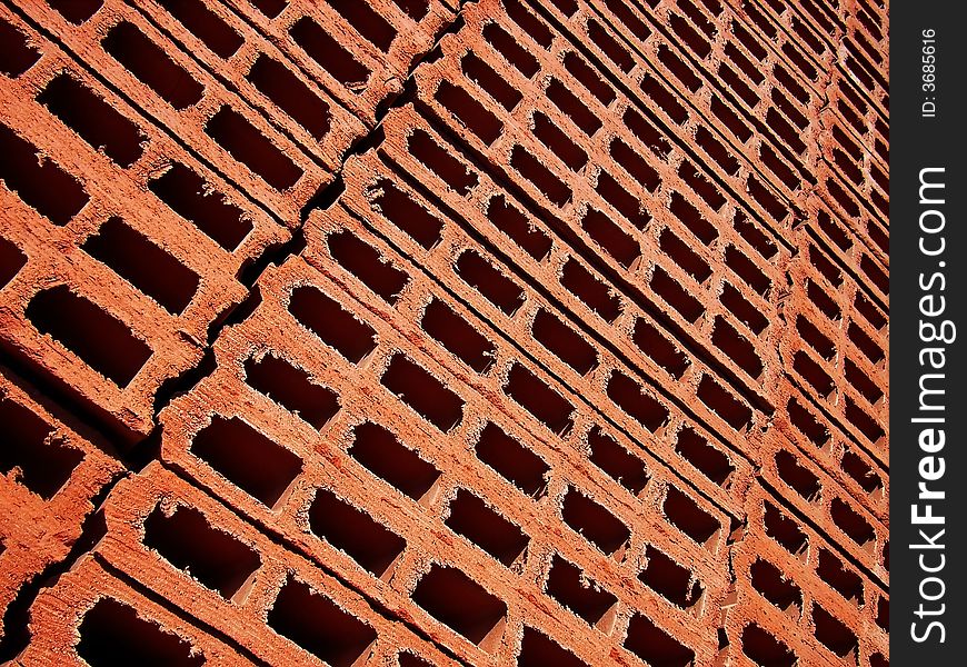 Detail of a lot of clay bricks stacked