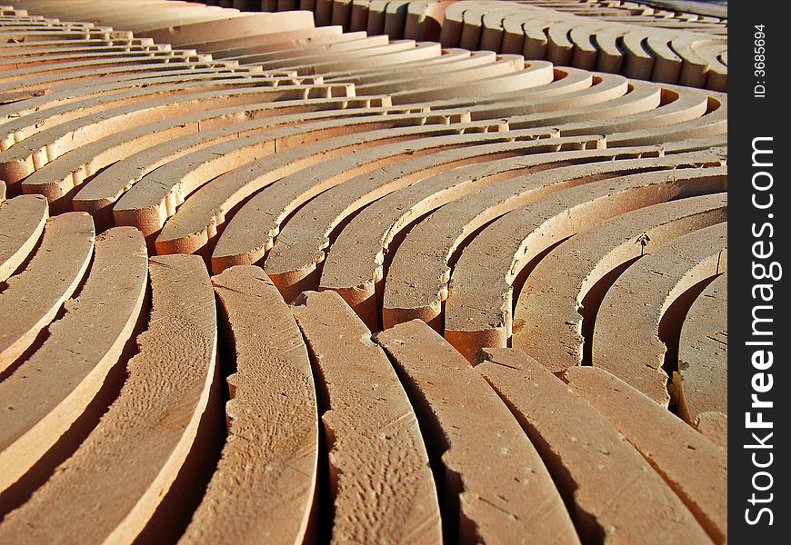 A lot of clay tiles stacked and ready to be used in a roof