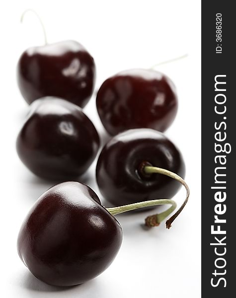 dark cherries on white background. dark cherries on white background