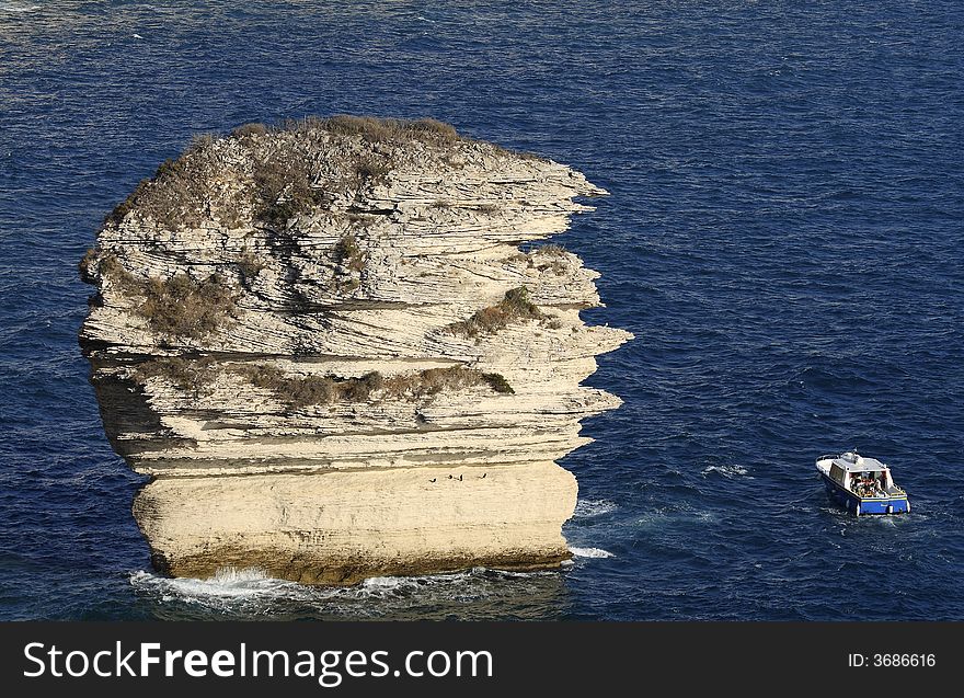 Le grain de sable is a rock in the Mediterranean
 at feet of Bonifacio's cliff, Corsica, France. Le grain de sable is a rock in the Mediterranean
 at feet of Bonifacio's cliff, Corsica, France