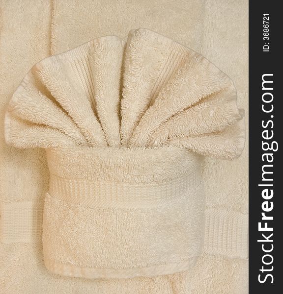 Fluffy towels folded in a fan, spa style. Fluffy towels folded in a fan, spa style.