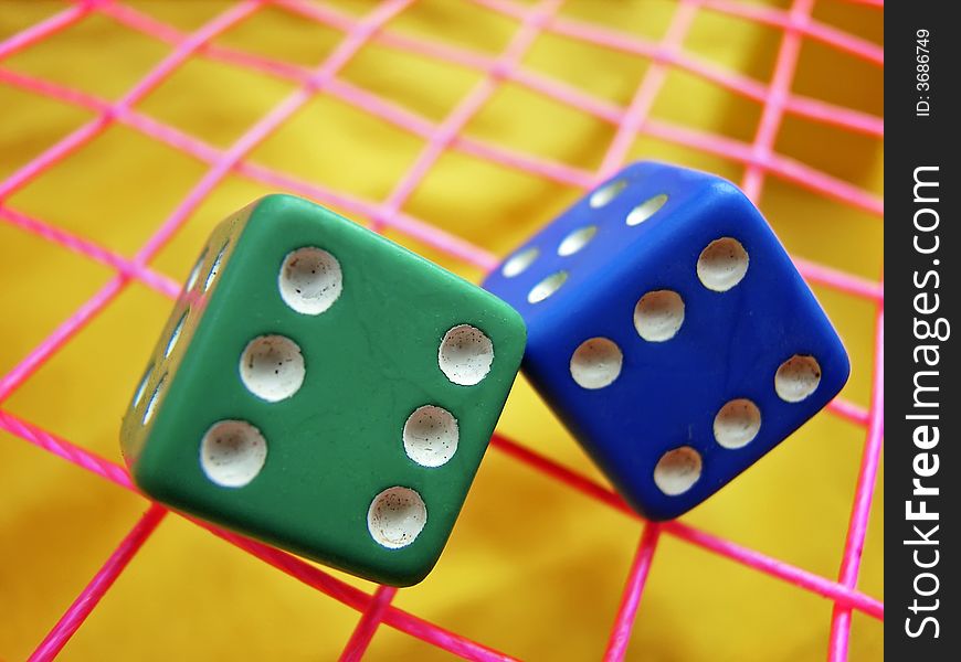 Green and blue dice used in board games