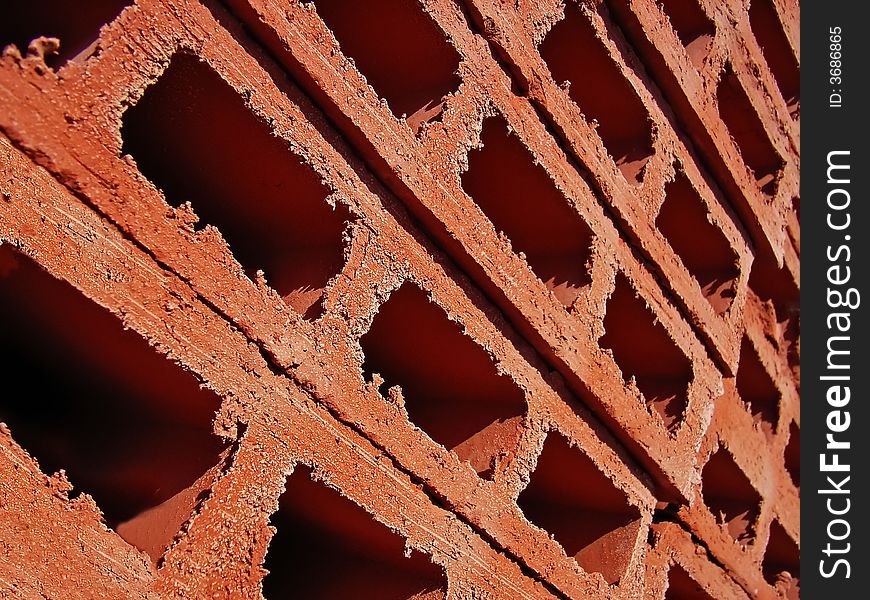 Red clay bricks stacked in a construction material store. Red clay bricks stacked in a construction material store