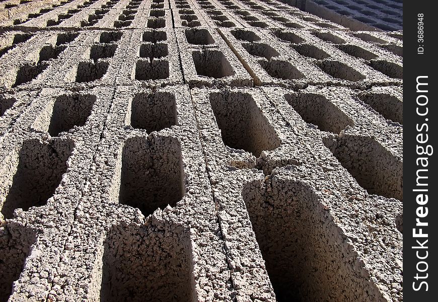 Rows of bricks stacked in a construction site