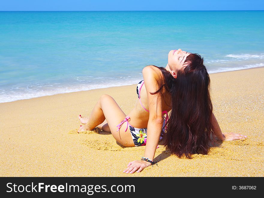 View of a young gorgeous female in summer environment. View of a young gorgeous female in summer environment