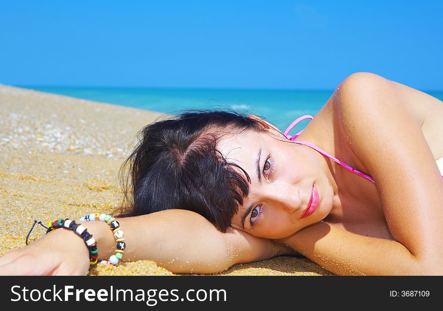 View of a young gorgeous female in summer environment. View of a young gorgeous female in summer environment